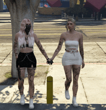 two women walking down the street holding hands with one wearing a mask