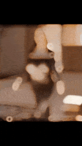 a blurred image of a statue with a heart shaped torso
