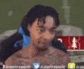 a man without a shirt is sitting in a chair and making a face .