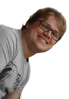 a man wearing glasses and a gray shirt with a picture of a shark on it
