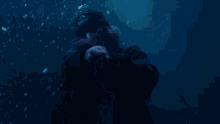 a man wearing a black beanie with the word puma on it is dancing in the snow