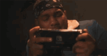a person with a tattoo on their arm playing a video game