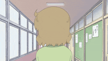 a cartoon girl is standing in a hallway with a green board on the wall