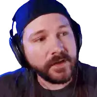 a man with a beard wearing a blue hat and headphones