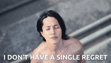 a shirtless man with his eyes closed and the words i do n't have a single regret