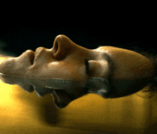 a close up of a person 's face in a body of water