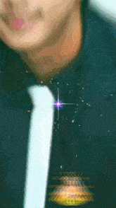 a close up of a man 's neck with a star in the background and a t.v.v.v.i. logo