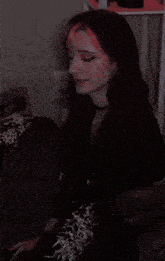 a woman with red hair is sitting in a chair with the words " really " on the bottom
