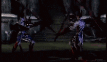 a group of people are fighting each other with swords in a video game .