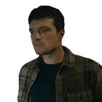 a man in a plaid shirt looks to his left
