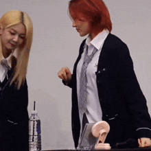 two girls in school uniforms standing next to each other