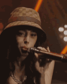 a woman singing into a microphone with calvin klein underwear