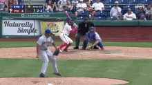 a baseball game is being played in front of a citizen 's bank park ad