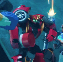 a red robot with green eyes is holding a torch