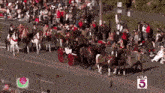 a horse drawn carriage is in a parade with ktla 5