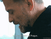 a man with a beard is talking about prague