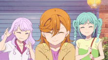 three anime girls standing next to each other with one making a face