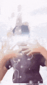 a person wearing headphones is taking a picture of themselves in a mirror