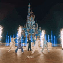 a group of people are dancing in front of a castle and the words ddimples are on the bottom