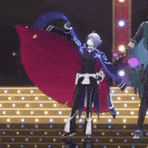 a man in a red cape is dancing on a stage in front of lights .