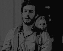 a black and white drawing of a man with suspenders
