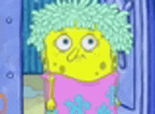 a cartoon character , spongebob squarepants , is wearing a pink dress and has a wig on .