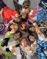 a group of people laying in a circle with one wearing a white hoodie that says " a bathing ape "
