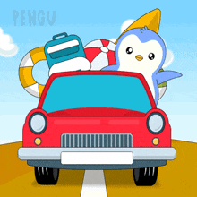 a penguin is sitting in the back of a red car with luggage and a surfboard