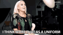 a woman says i think wore that as a uniform in front of a marie claire logo