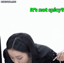a woman is holding a pencil in her hand and says it 's not spicy