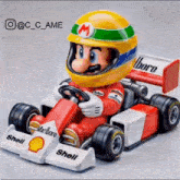 a toy mario is driving a race car with shell on the side .