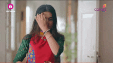 a woman covering her face with her hand in front of a jio cinema logo