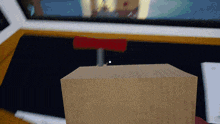 a wooden box with a red button on top