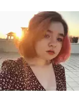 a girl with red hair is taking a selfie on a rooftop