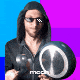 a man wearing a hoodie and sunglasses is holding a pot with the word mcdh written on the bottom