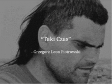 a black and white photo of a man with the words " taki czas " above him