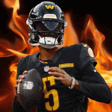 a man wearing a helmet with the number 5 on it