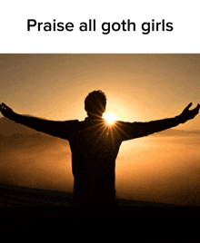 a picture of a man with his arms outstretched and the words praise all goth girls below him
