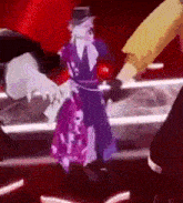 a man in a top hat and a purple dress is dancing on a stage with other people .