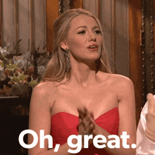 a woman in a red dress is clapping her hands and the words oh great are above her
