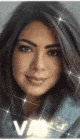 a close up of a woman 's face with the letter v on the bottom right