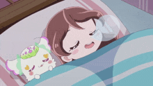 a girl is sleeping next to a stuffed animal with hearts on its head
