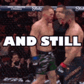 two men are standing next to each other in a boxing ring with the words `` and still '' written above them .
