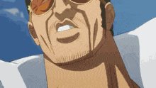 a close up of a man 's face wearing sunglasses and a white shirt