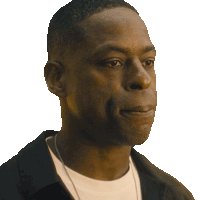 a close up of a man 's face with a white shirt and black jacket