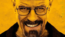 a man with glasses and a beard is smiling with a yellow background