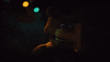 a close up of a teddy bear with glowing eyes