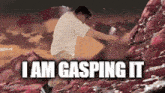 a man in a white shirt is standing on a rock with the words " i am gasping it " written below him