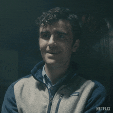 a man wearing a patagonia jacket is smiling in a netflix ad