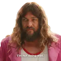 a man with long hair and a beard has the words i 'm not doing well on his shirt